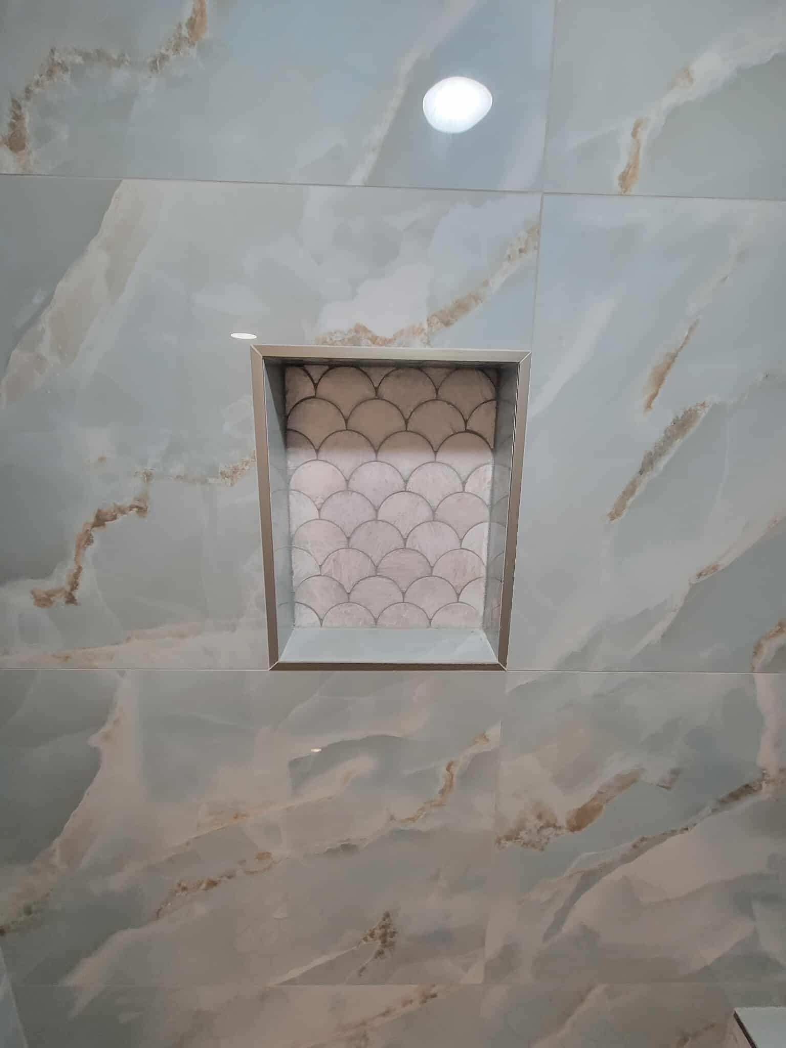 Detail shot of blue marble bathroom tile work