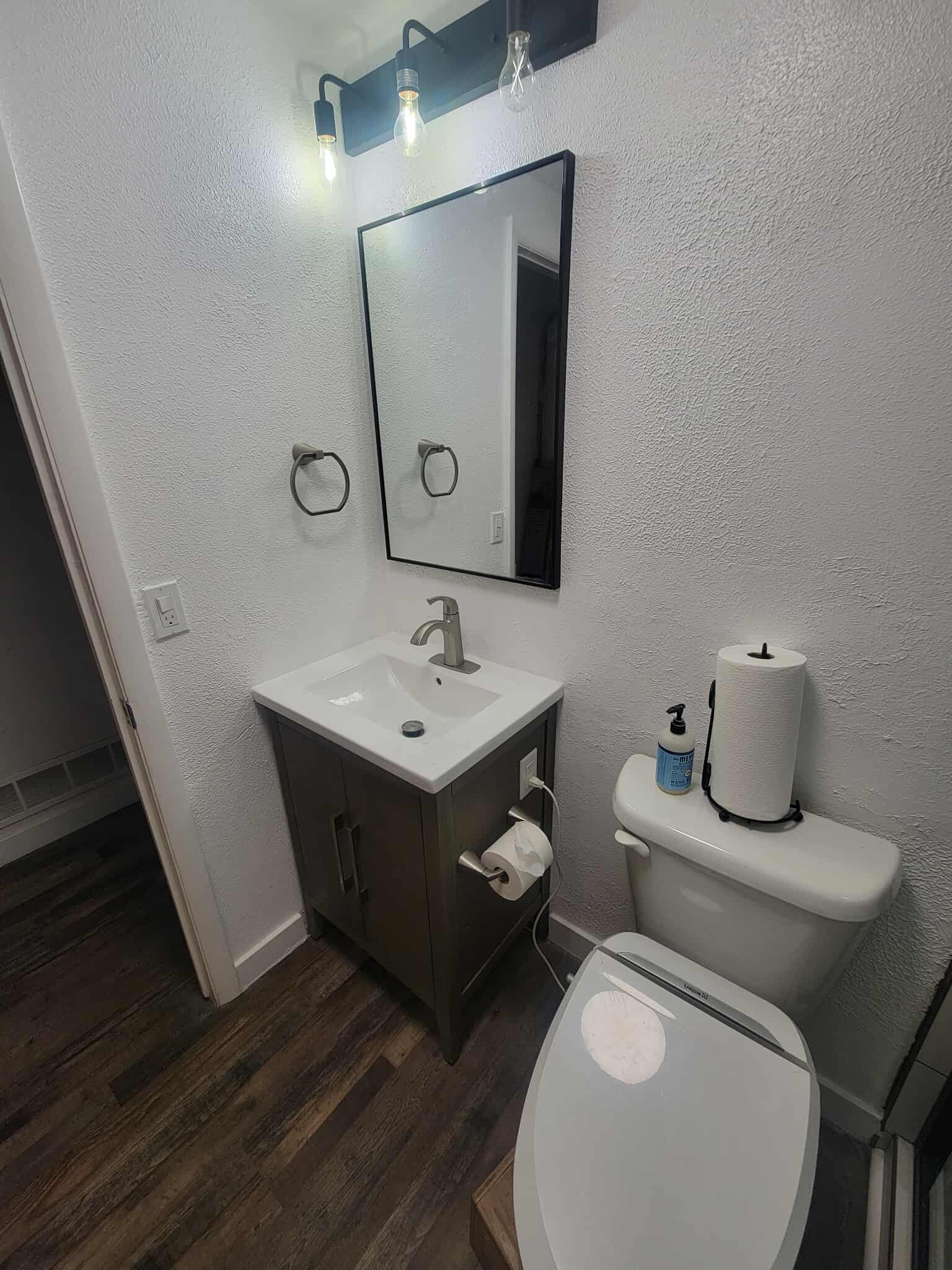 Matching half bath with modern fixtures